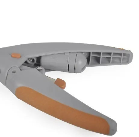 White plastic dog nail clipper with built-in LED light and red guide line on a blister card.