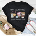 Black straight cut cotton t-shirt with round neck and short sleeves laid flat.