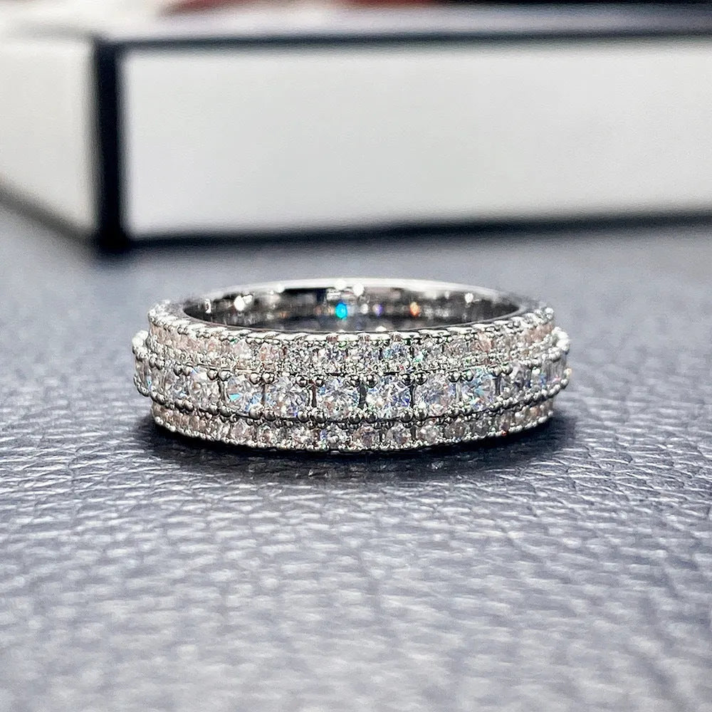 Geometric triangle zircon ring in three colour options showing detailed inlay work