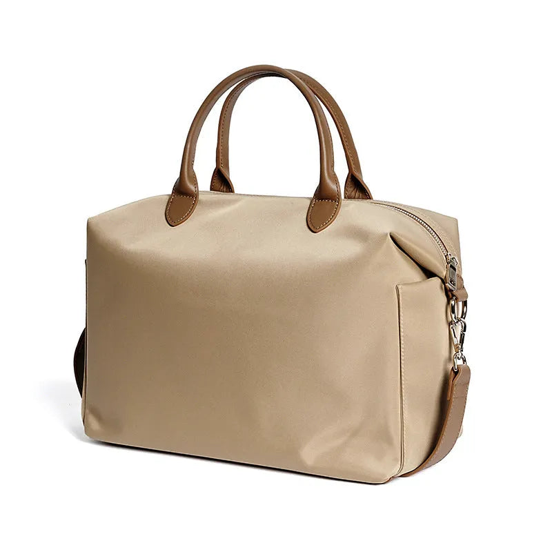 Black waterproof nylon shoulder bag with leather trim showing front view and interior