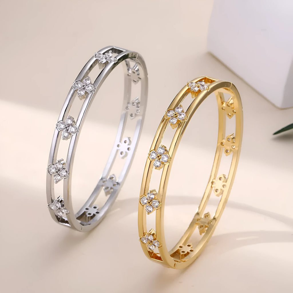 Women's hollow bracelet with four-leaf clover charm and zircon stones in gold or silver