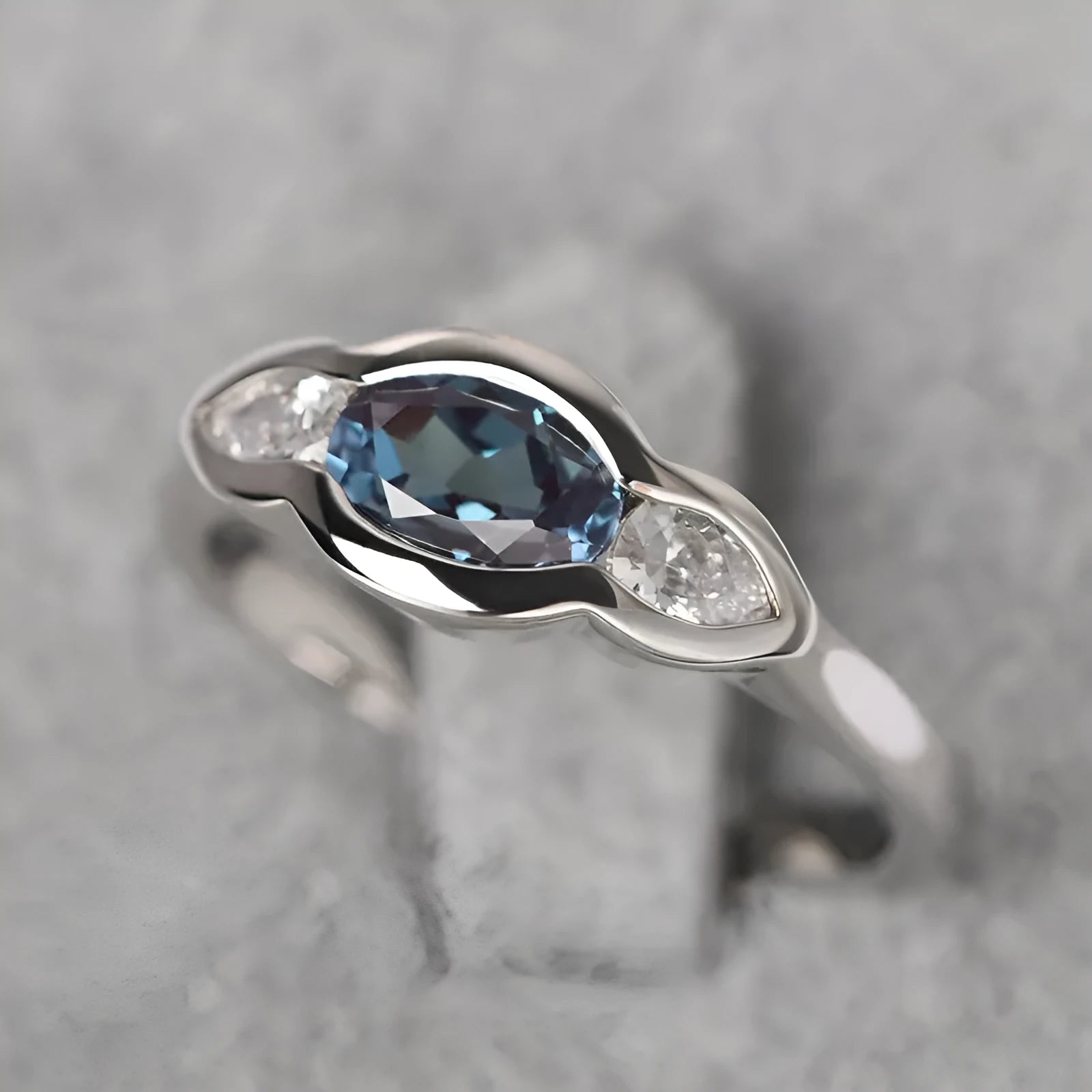 Geometric ellipse women's ring with inlaid zircon stones in white gold colour