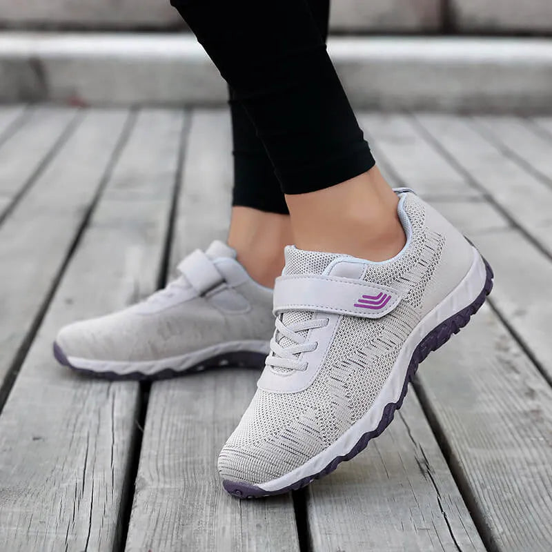 Women's low-top grey purple wedge heel shoes with velcro strap and breathable mesh upper.