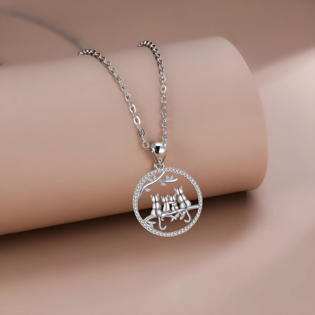 Four kitten pendant necklace with copper chain and cross link design