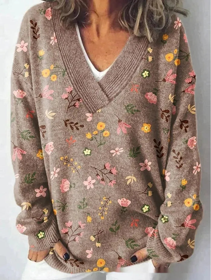 Women's V-neck long sleeve sweatshirt with a blue and white 3D floral print pattern.