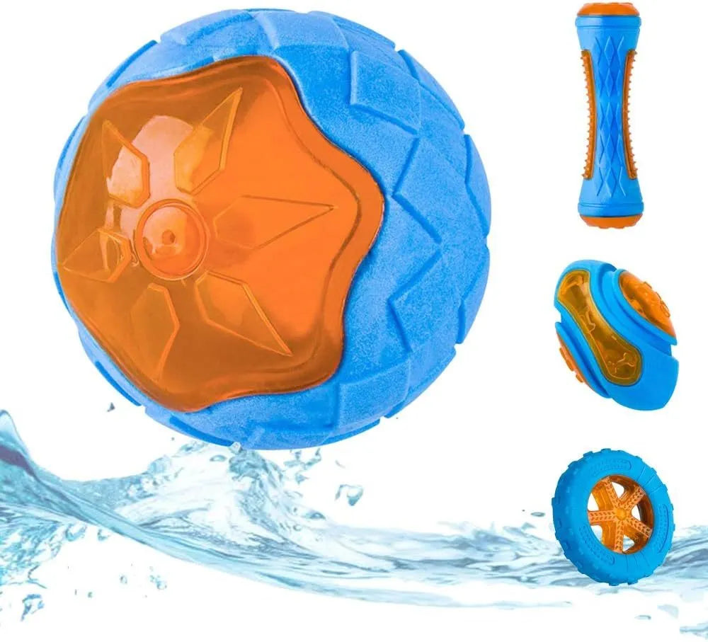 Set of three dog toys: a red ball, a blue barbell, and an orange tyre, floating in water.
