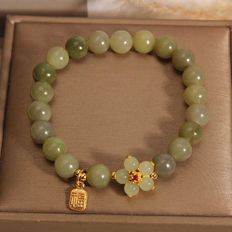 A women's casual alloy bracelet with a grey jade colour finish and a clasp.