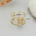 Adjustable open ring with 14K copper-plated gold finish and U-shaped asymmetric design