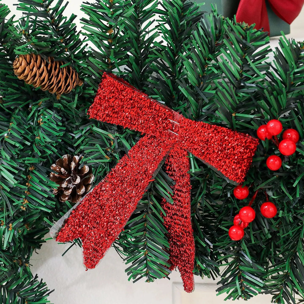 70cm tall Christmas rattan decorative cane with pine cone and red bow, shown on a festive table setting.