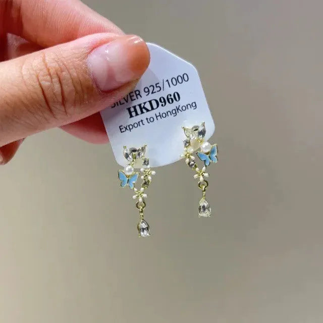 Geometric heart-shaped women's earrings with rhinestone accents and tassel details in electroplated alloy