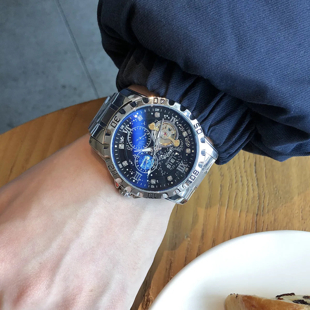 Men's silver automatic mechanical watch with black starry dial and leather strap