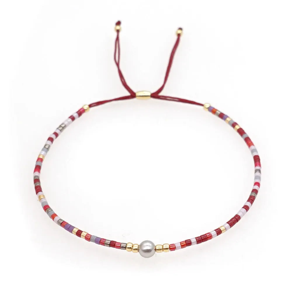 Women's handmade bohemian bracelet with semi-precious stone bead and colourful glass beads.