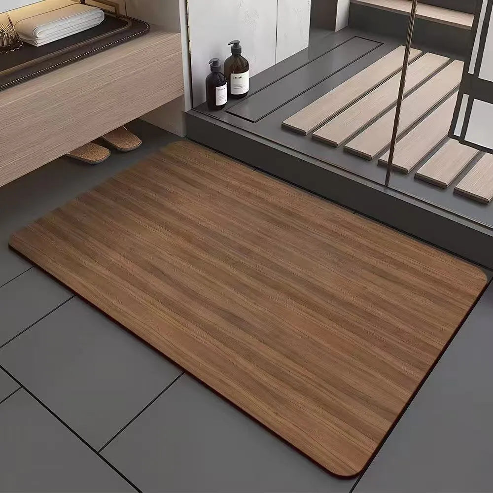 Square diatomite bathroom floor mat with geometric print in a wood grain colour on a tiled floor.