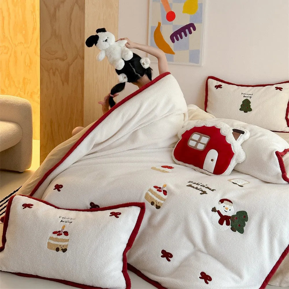 Winter Christmas cartoon print bed linen four-piece set showing fitted sheet, duvet cover, and pillowcases.