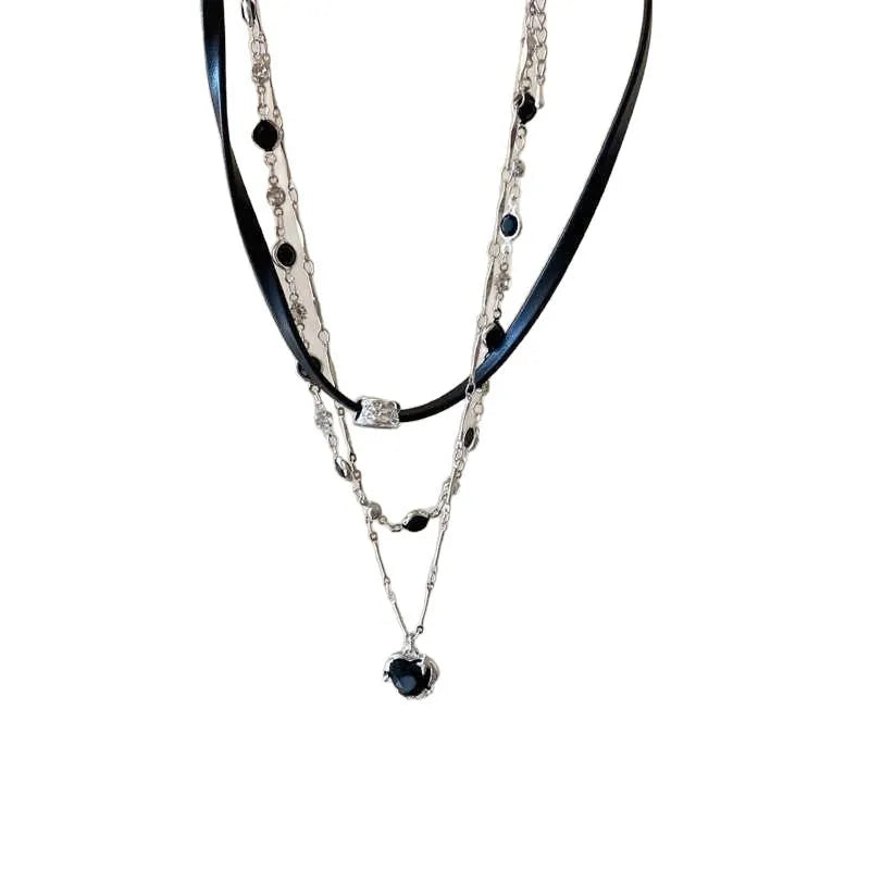 Women's twin necklace set showing double-layer leather heart and single-layer love designs with alloy and crystal elements