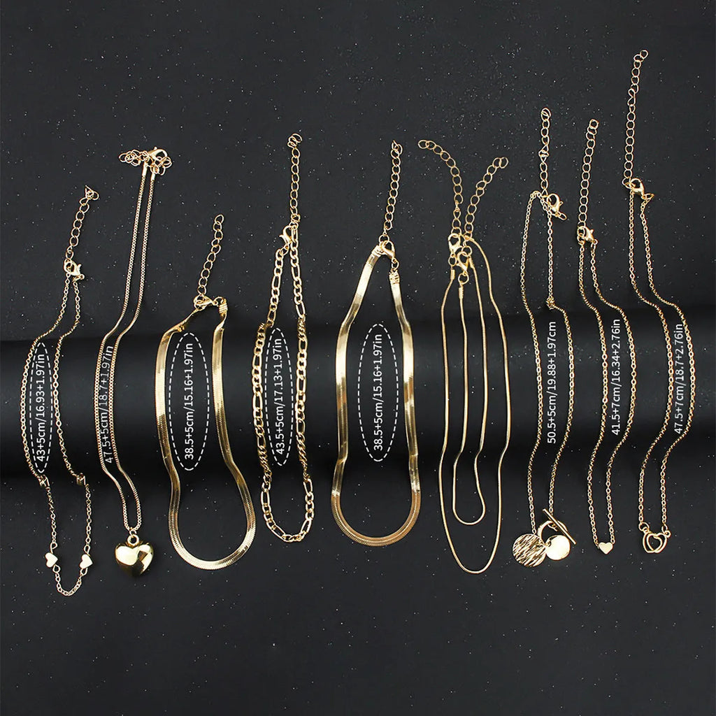 Gold electroplated women's necklace set with 10 pieces featuring snake bone chains and alloy pendants