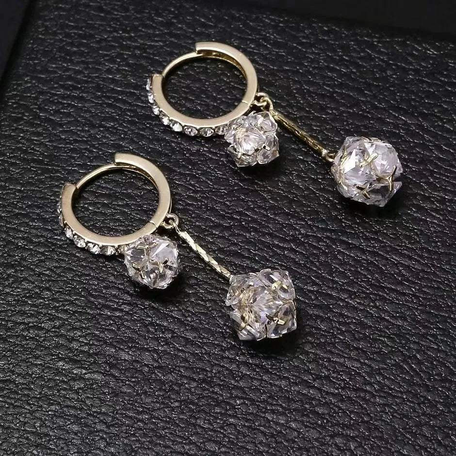 Women's silver drop earrings with confession balloon and rhinestone ball pendants connected by tassel detailing