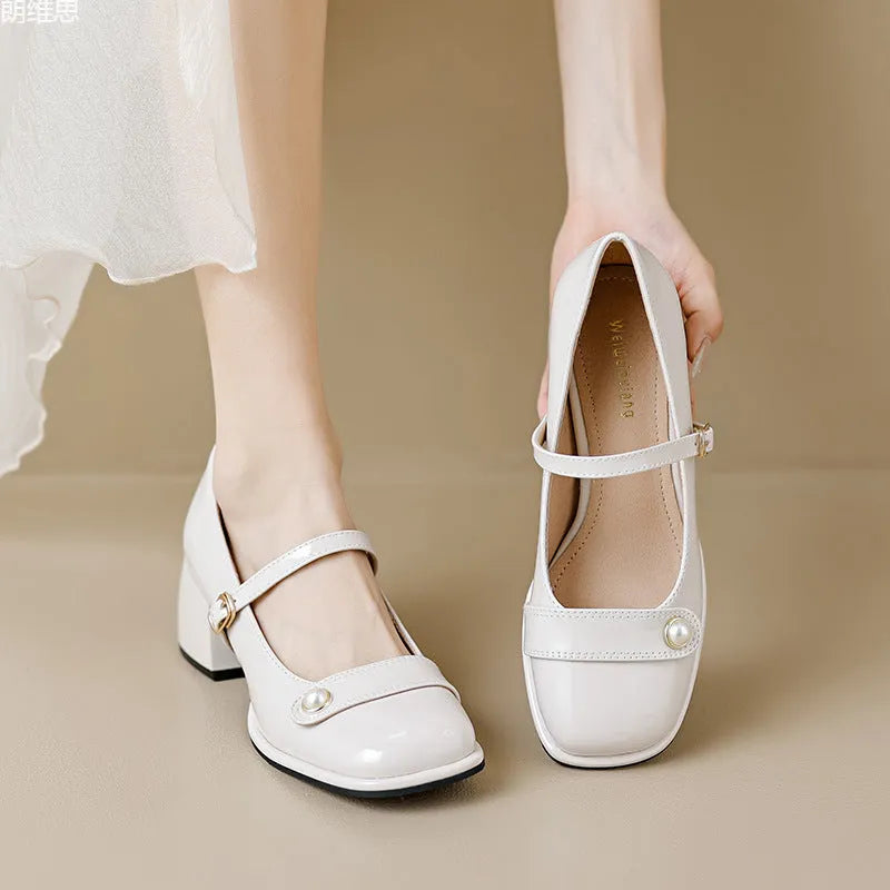 Plus size women's patent leather chunky heel pumps with square toe and buckle fastening in apricot colour.