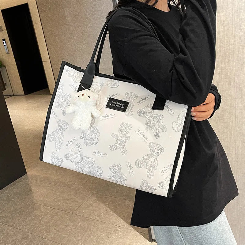 Women's black and white canvas tote bag with rhombus pattern and horizontal square shape