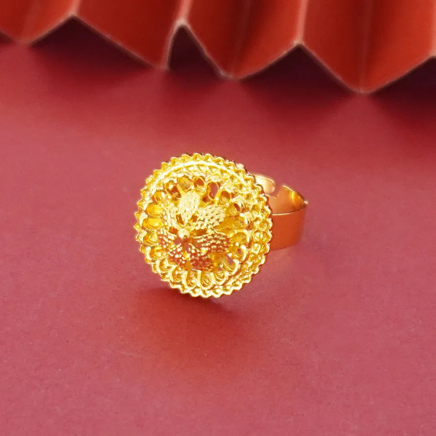 Gold-plated three-piece jewelry set showing necklace, earrings, and ring with a detailed flower design pendant.