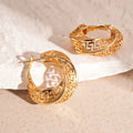 Geometric hollow stud earrings with twisted round design in gold or silver finish