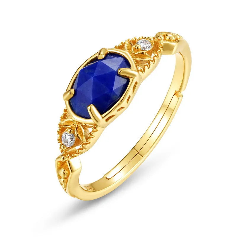 Geometric ellipse lapis lazuli silver ring with Japanese style design on a model's hand.