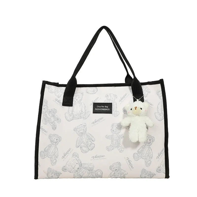 Women's black and white canvas tote bag with rhombus pattern and horizontal square shape