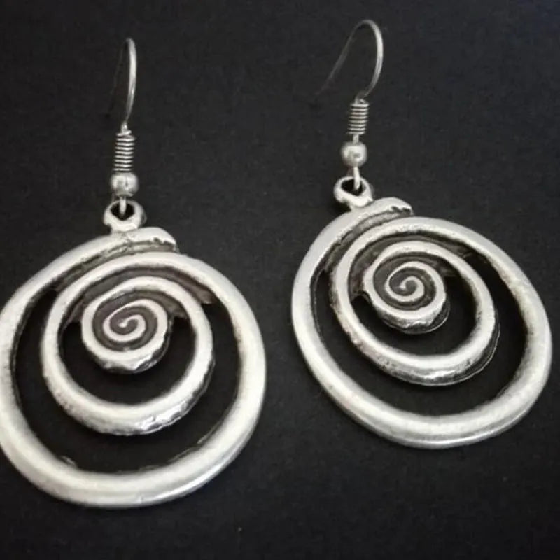 Geometric spiral earrings with distressed silver finish and retro design