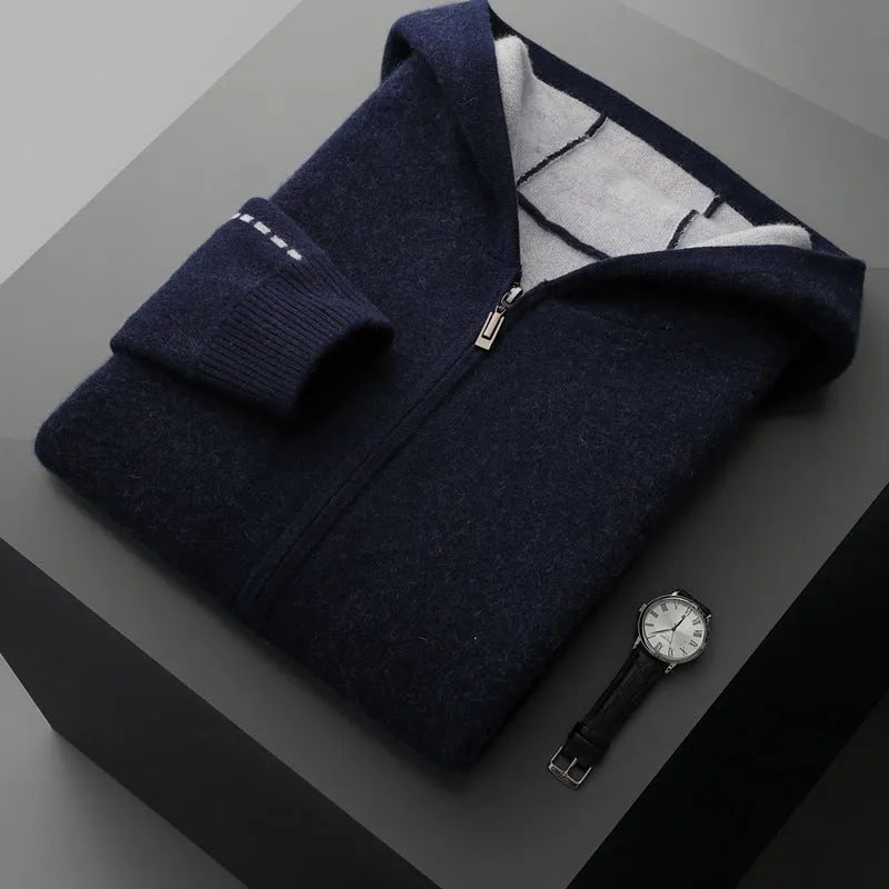 Man wearing a dark blue zip-up cardigan sweater with a half-high collar.