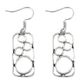 Geometric alloy earrings with round ring design and irregular square shape in antique silver colour