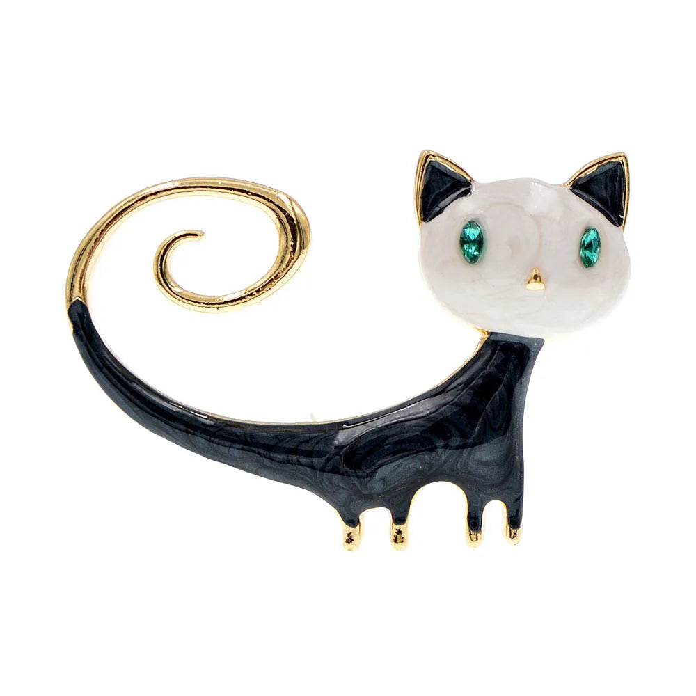 Orange and white alloy brooch with painted design of a cat with its tail up.