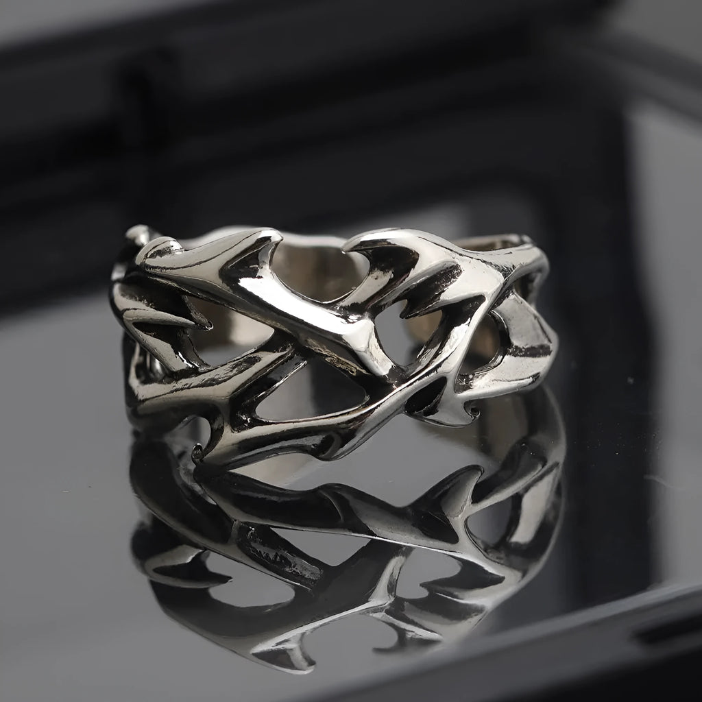 Copper geometric ring with thorn and flower design featuring adjustable opening mechanism