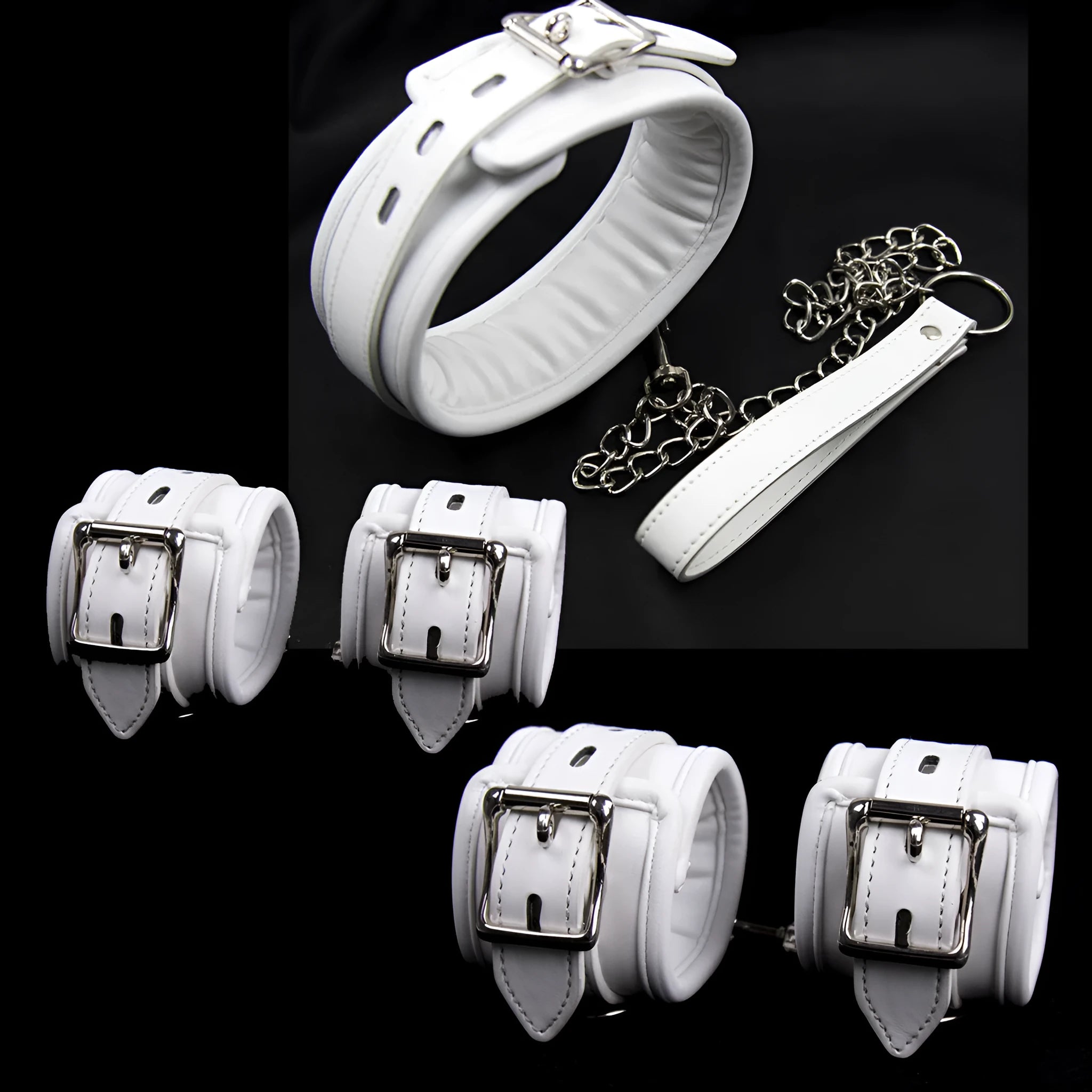 White PU sponge sex toy bondage kit showing handcuffs, foot cuffs, and a neck scarf arranged together.