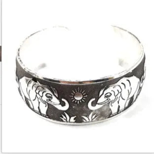 Carved open Miao silver bracelet with Roman shape design in turtle or elephant colour