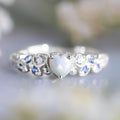 Women's alloy heart ring with floral opal ocean design in peach colour on size display