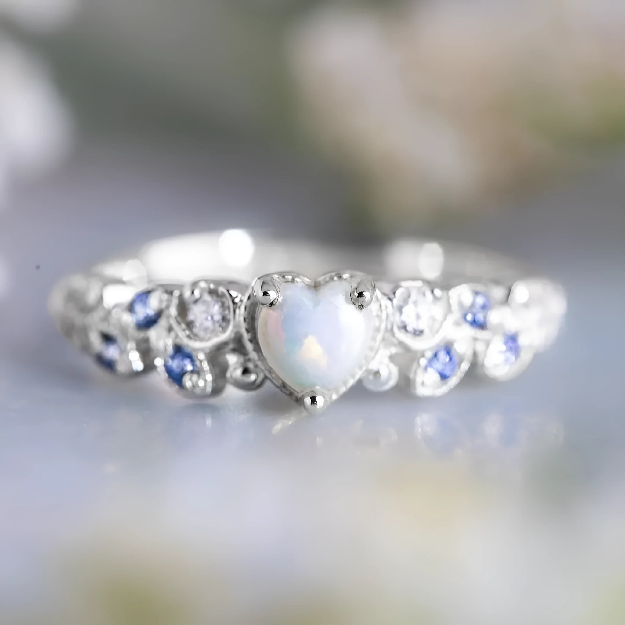 Women's alloy heart ring with floral opal ocean design in peach colour on size display