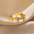 Golden geometric women's ring with diamond pattern on titanium steel band