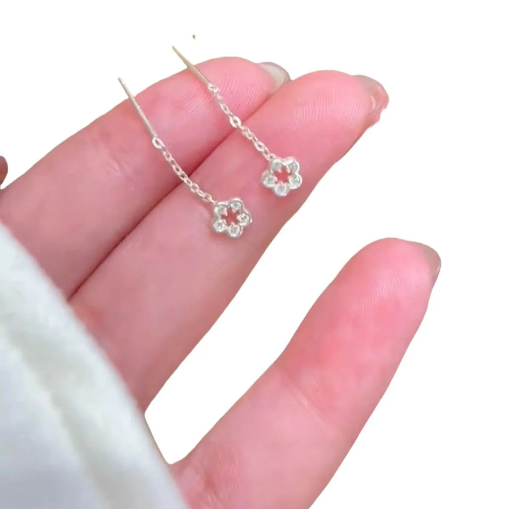 Silver colour flower hanging earrings with natural petal design and needle posts