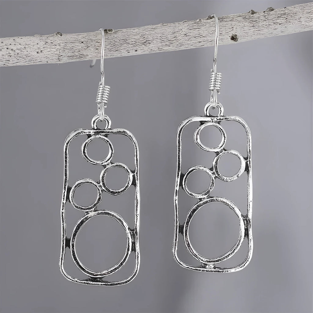 Geometric alloy earrings with round ring design and irregular square shape in antique silver colour