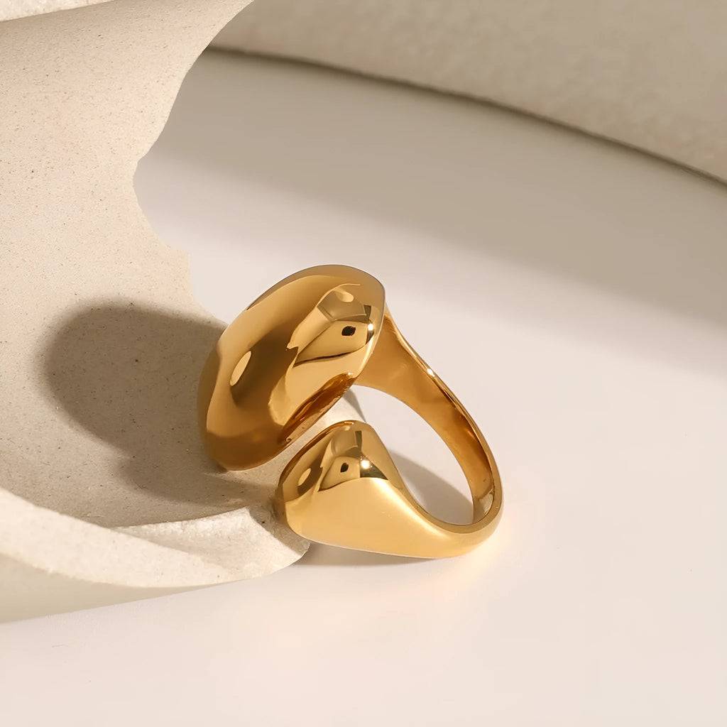 Women's exaggerated geometric stainless steel open ring with electroplated finish.