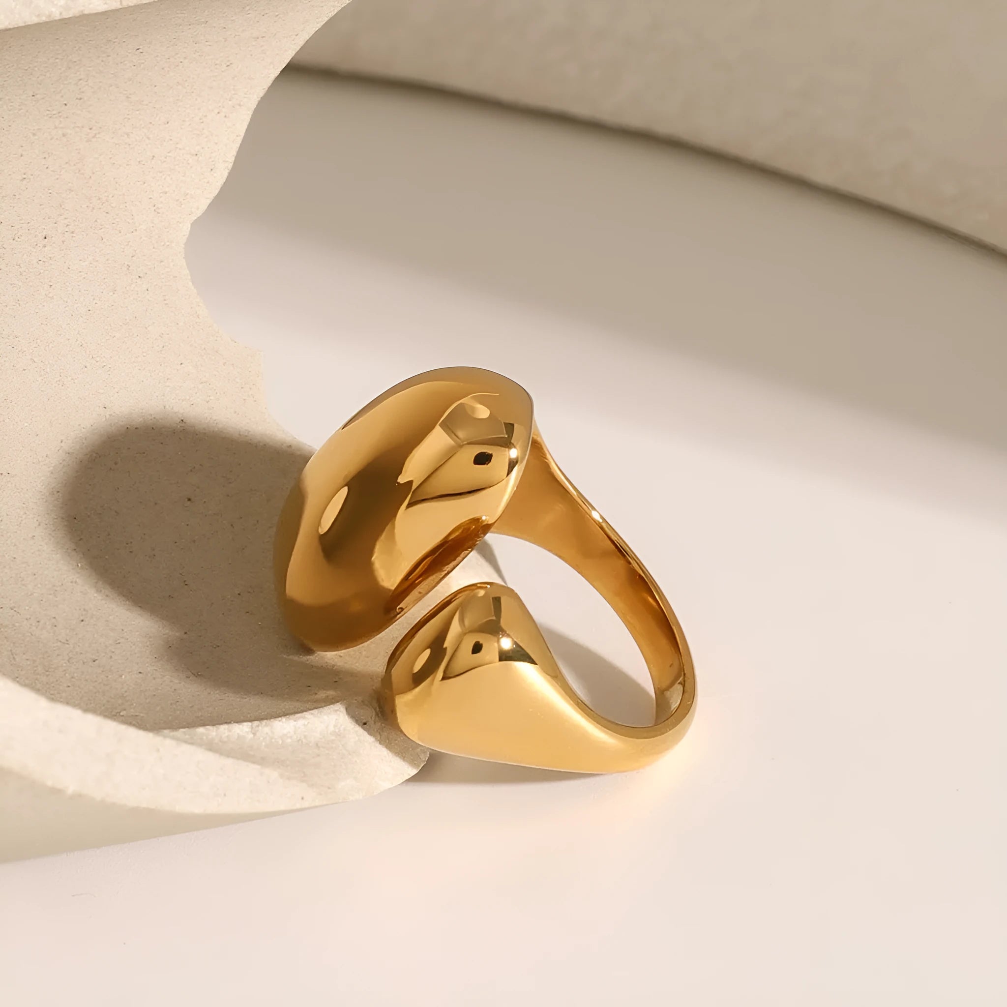 Women's exaggerated geometric stainless steel open ring with electroplated finish.