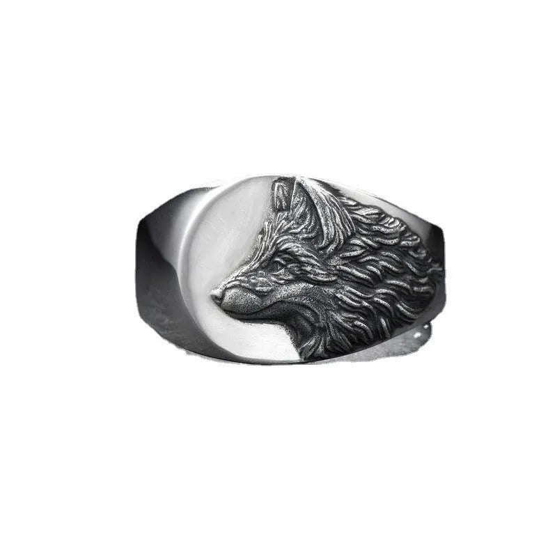 Men's silver geometric wolf ring with retro domineering shape on a hand.