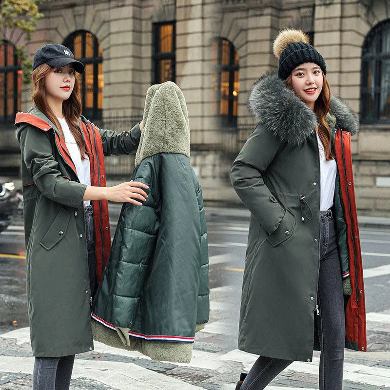Women's long beige trench coat with fleece lining on a hanger, showing its extended length and elegant style.