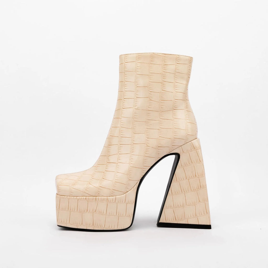 Women's ankle boot in artificial PU with a high heel above 8cm, shown in a solid colour.