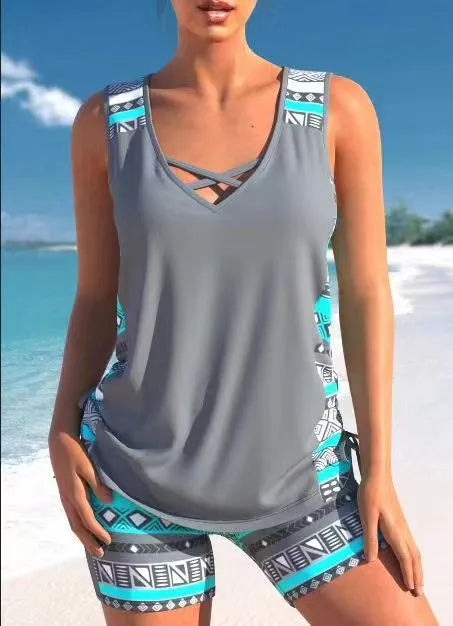 Women's floral printed two-piece swimsuit with sleeveless top and matching shorts in blue or green