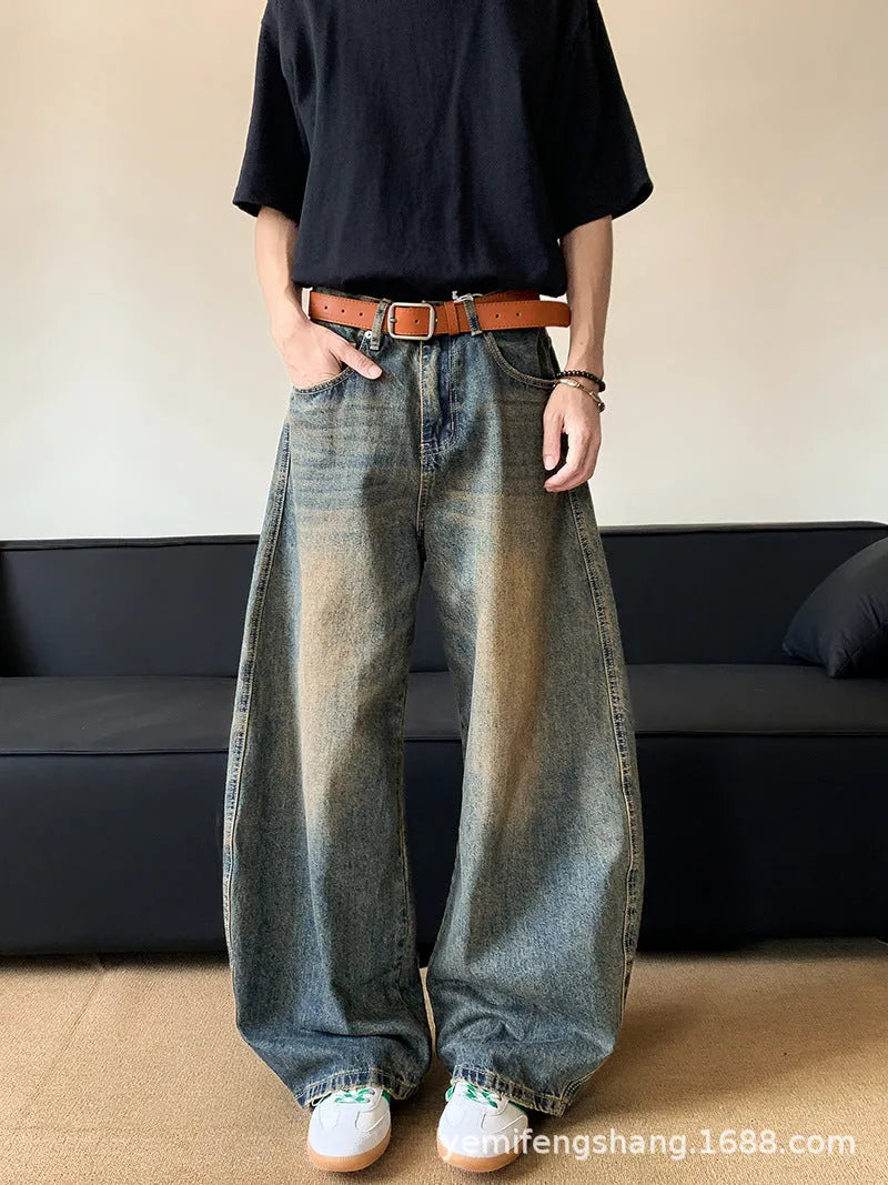 Men's retro blue distressed denim wide-leg jeans with a slimming fit and zip fly