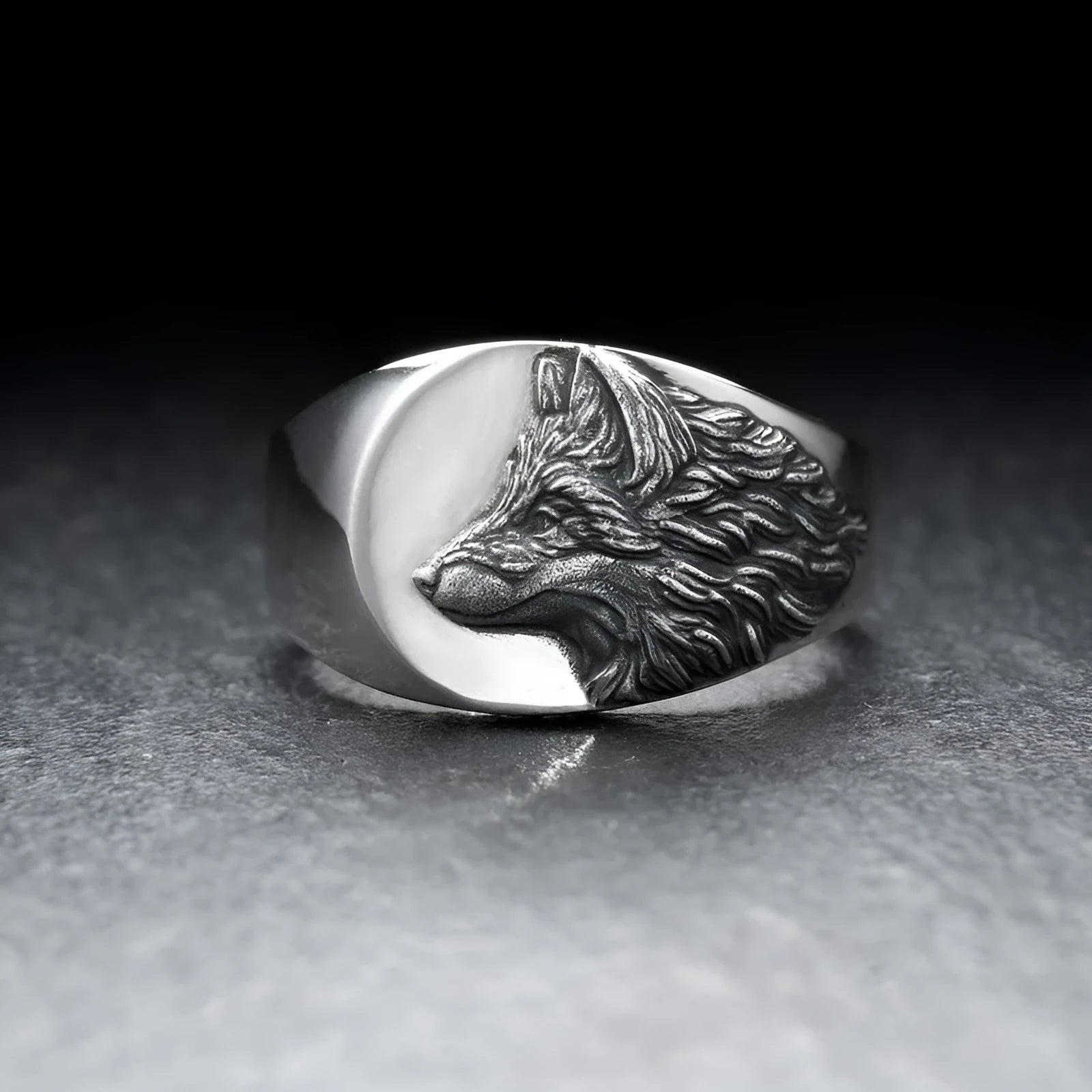 Men's silver geometric wolf ring with retro domineering shape on a hand.