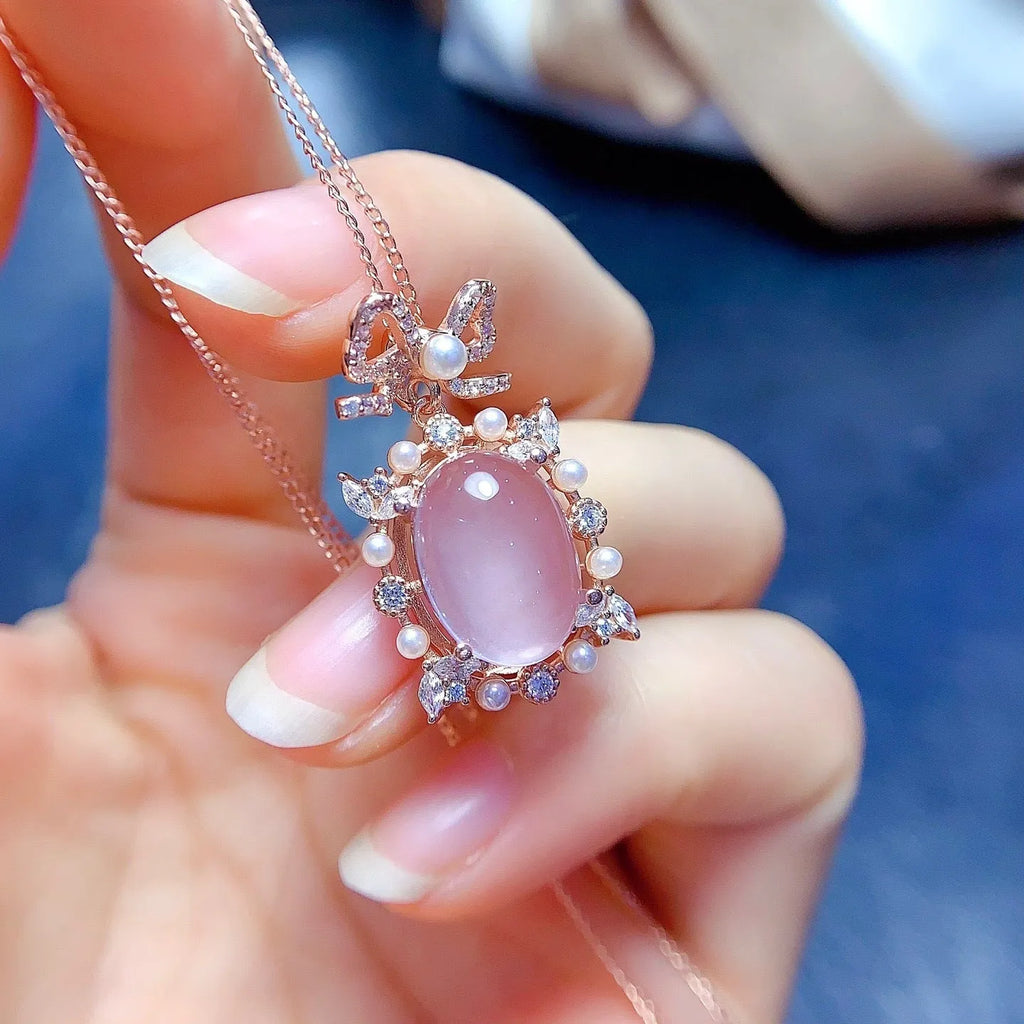 Geometric pink rose quartz pendant on silver necklace with rose gold plating