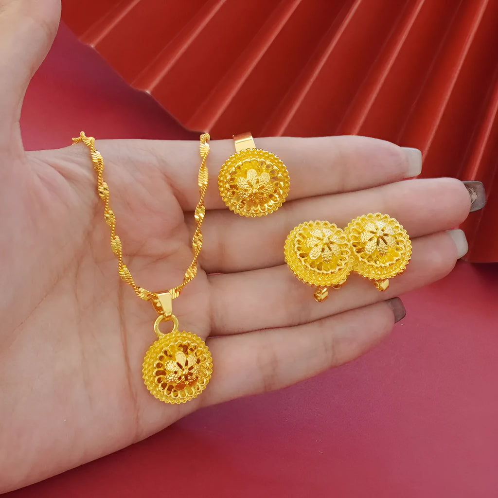 Gold-plated three-piece jewelry set showing necklace, earrings, and ring with a detailed flower design pendant.