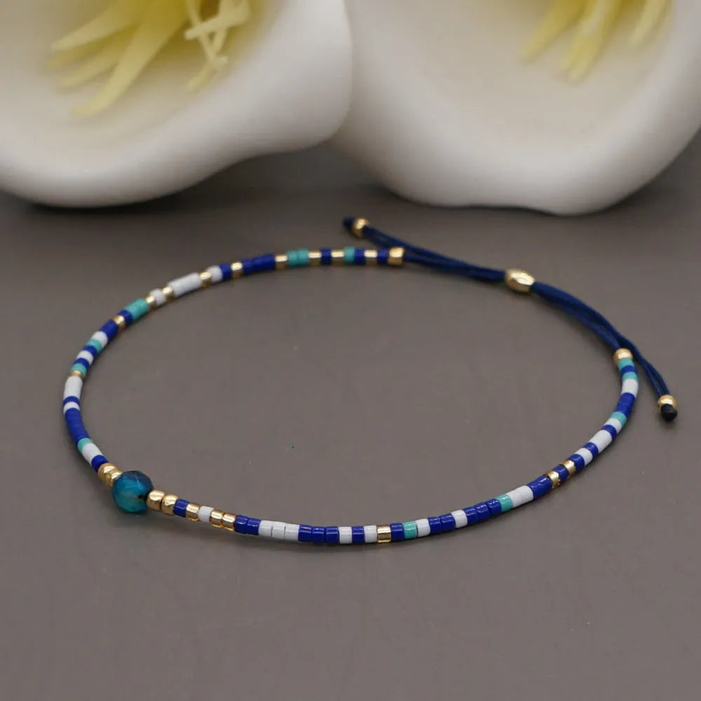 Women's handmade bohemian bracelet with semi-precious stone bead and colourful glass beads.
